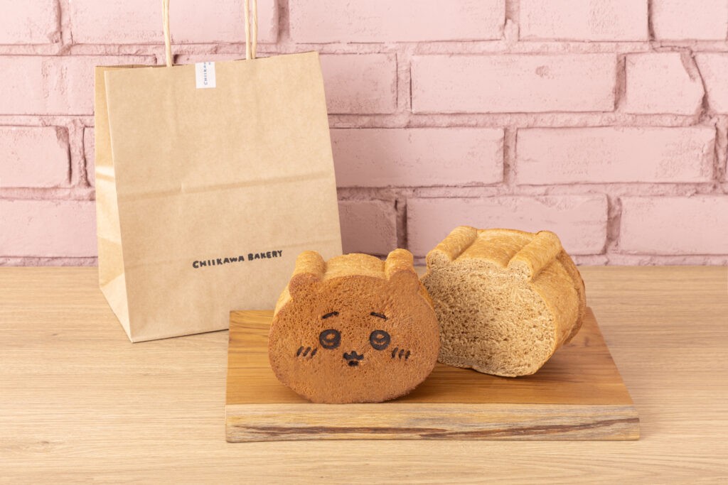 Chiikawa-shaped bread loaf beside a Chiikawa Bakery paper bag from the Okinawa pop-up