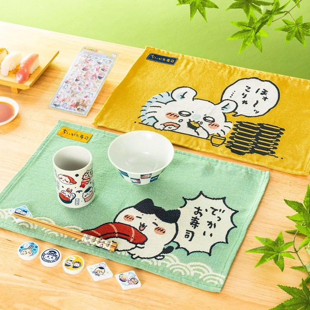 Chiikawa Sushi series placemats, rice bowl, tea cup and chopsticks styled with nigiri on a wooden table