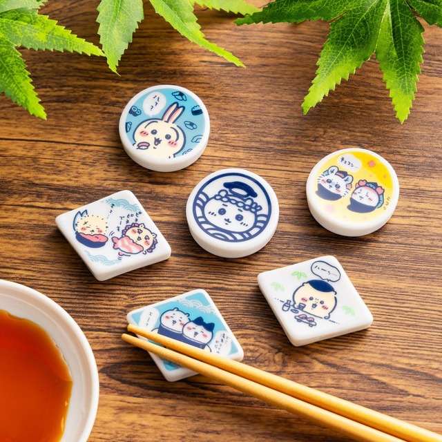 Six Chiikawa Sushi ceramic chopstick rests with character sushi art arranged beside soy sauce and chopsticks