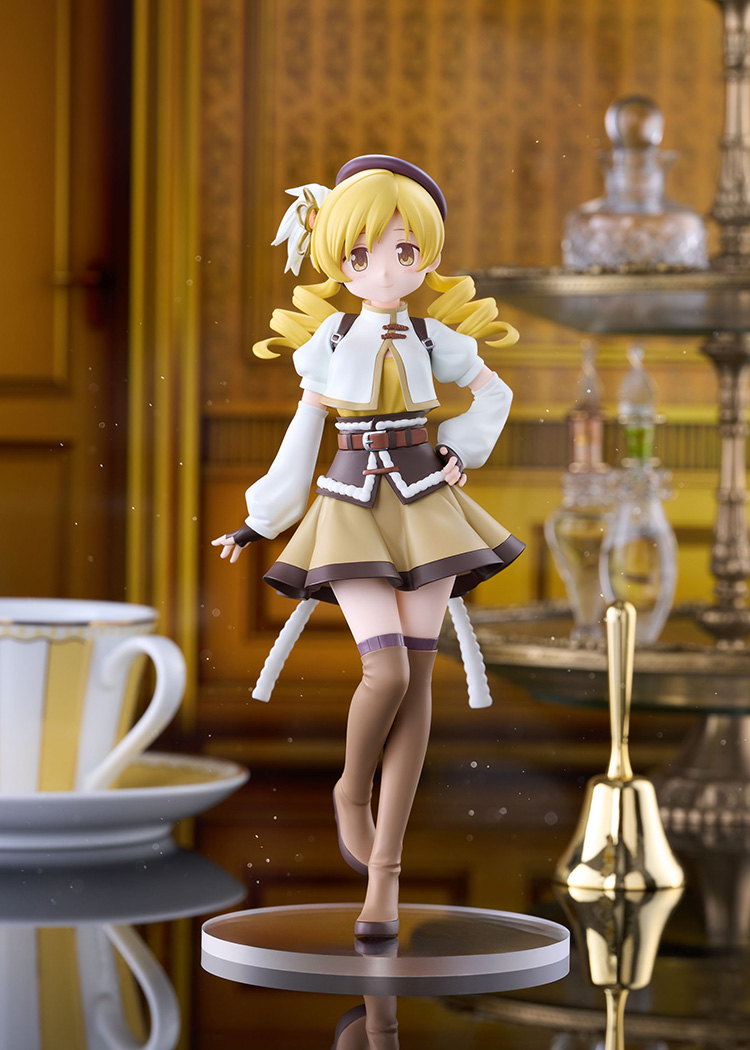 Tomoe Mami non-scale figure on a clear base in a golden room with a striped teacup and a brass bell, wearing a beret, white jacket and brown skirt