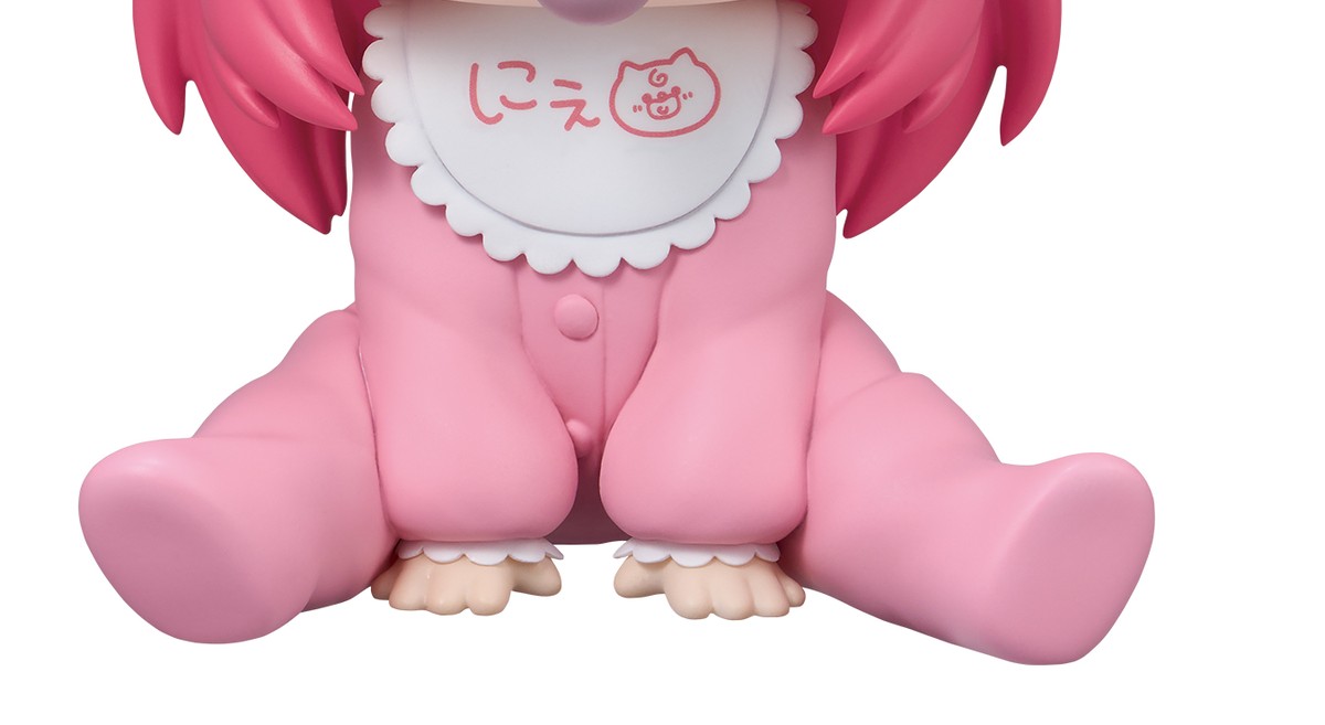 Lower-body detail of Holobabies Sakura Miko's seated pose in the buttoned pink onesie with frilled cuffs