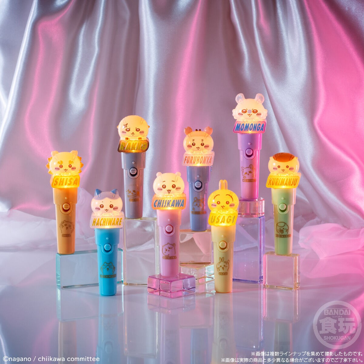 All eight Chiikawa light stick charms glowing together in low light