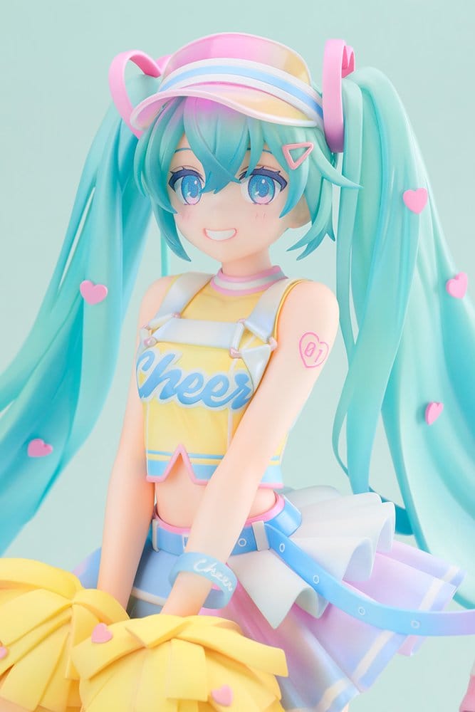 Close-up of Hatsune Miku Cheerleading Ver. figure face with pink visor heart hair clip and Cheer crop top