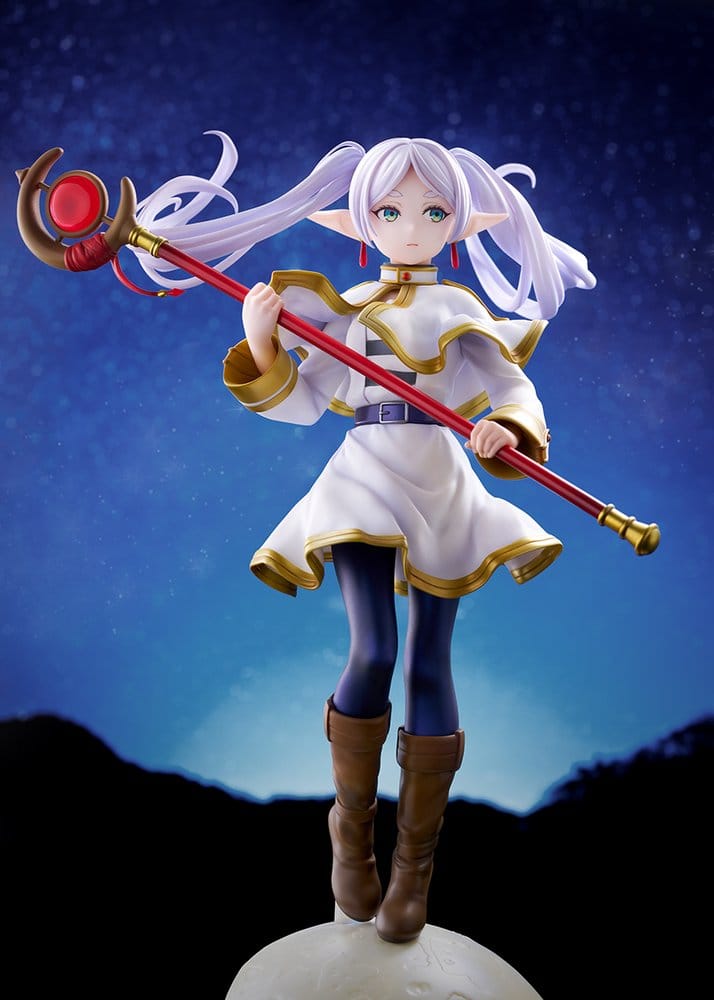 Front view of the Frieren figure against a starry night sky, standing on the pale moon base with her staff held diagonally and her white and gold capelet lifting