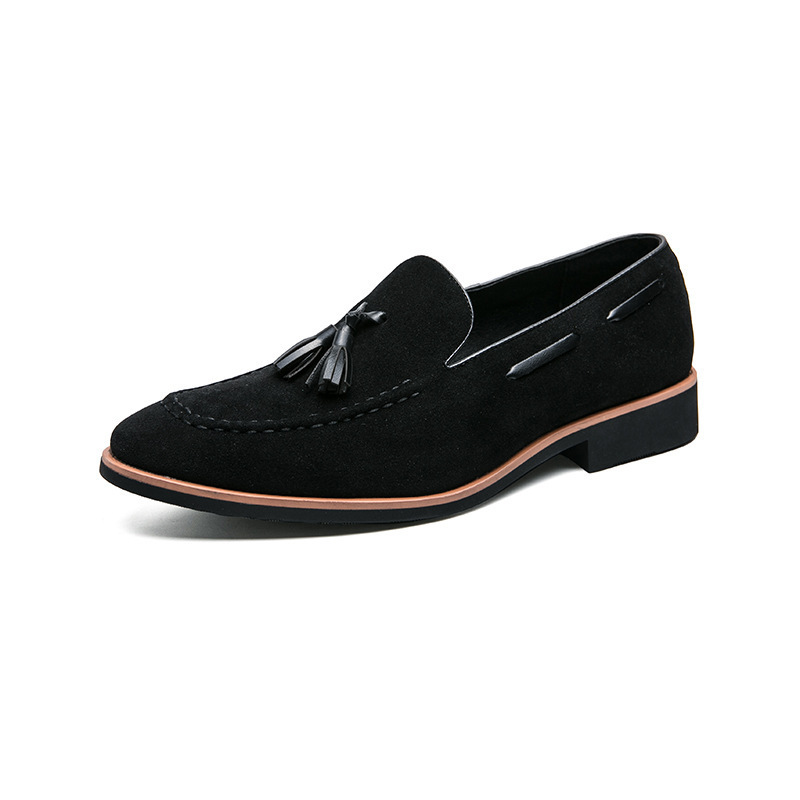 VintageVintage dark green loafers with delicate tassel decoration