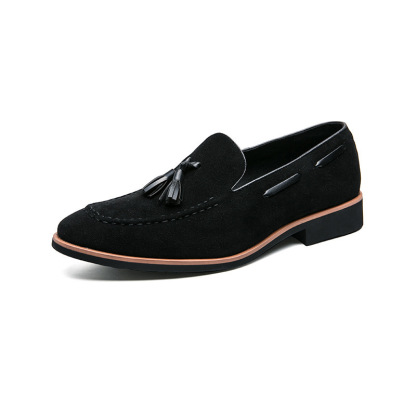 VintageVintage dark green loafers with delicate tassel decoration