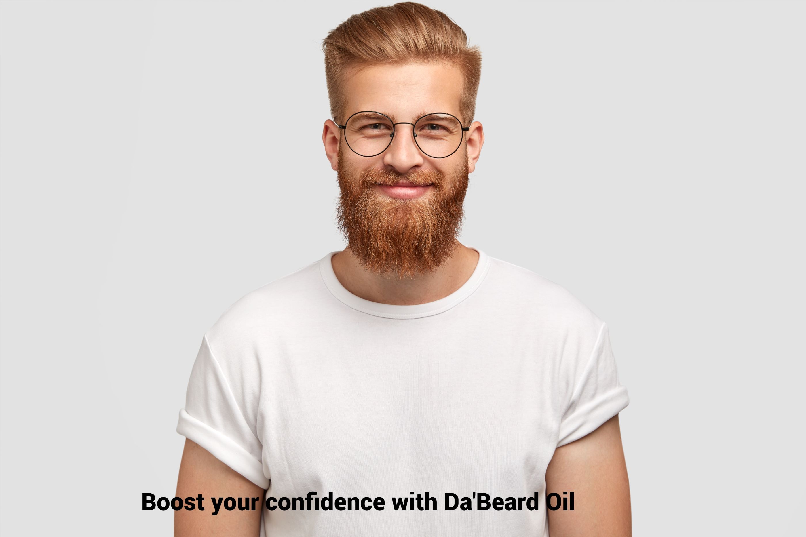 Impressive nerdy redhead in white vest smiling with a full pleasant beard groomed with Da'Beard Oil