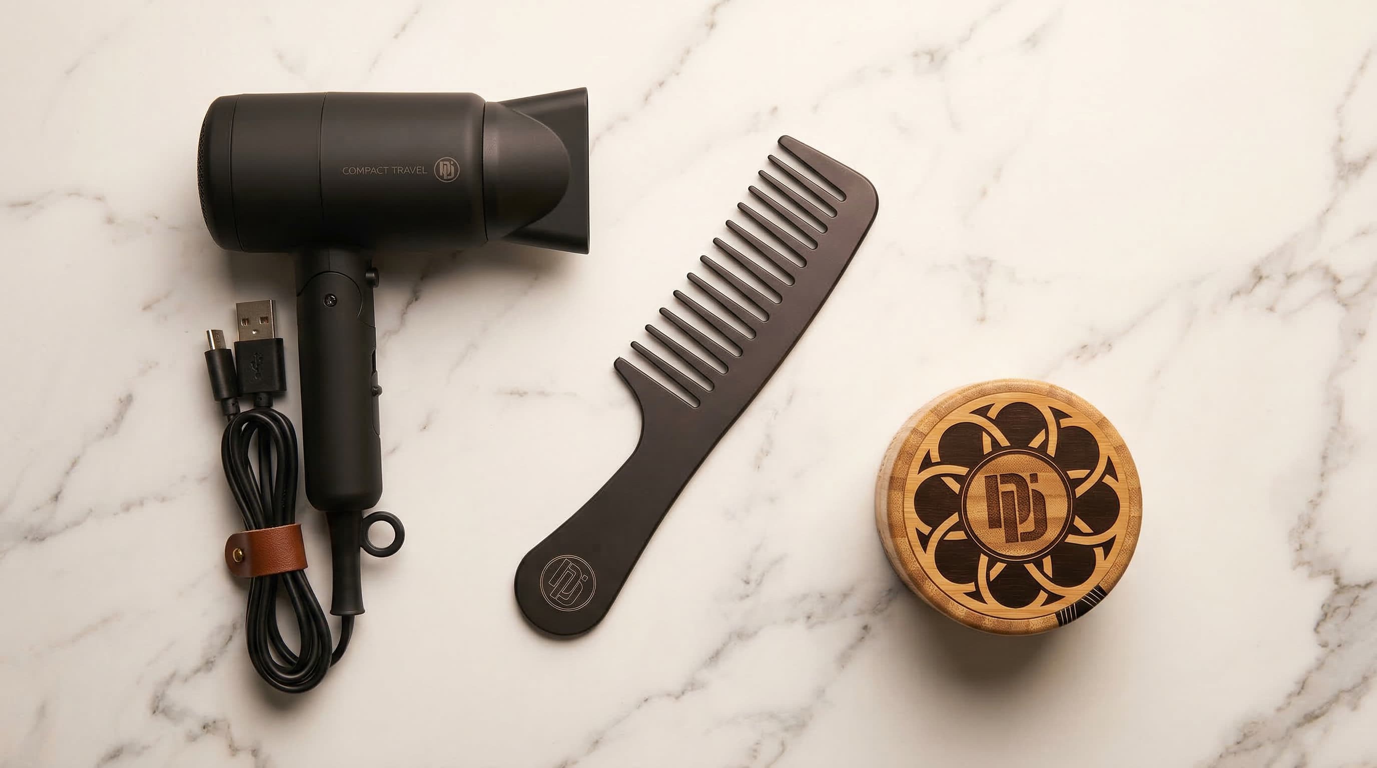Flat-lay of men's essential hair styling tools &mdash; wide-tooth comb, blow dryer, and matte wax &mdash; for a quick 5-minute grooming routine