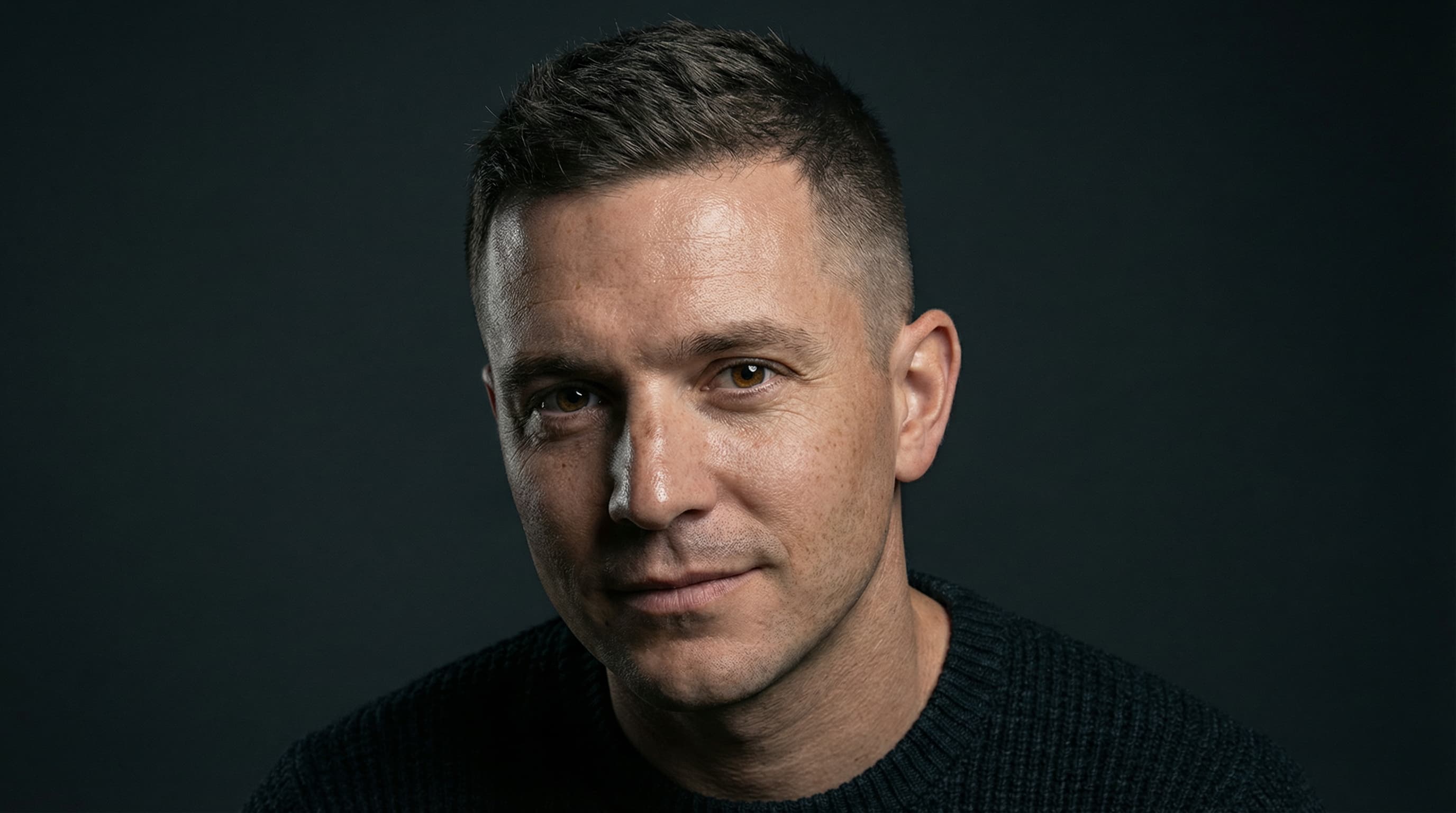 Grown-out buzz cut with natural texture and minimal styling for men