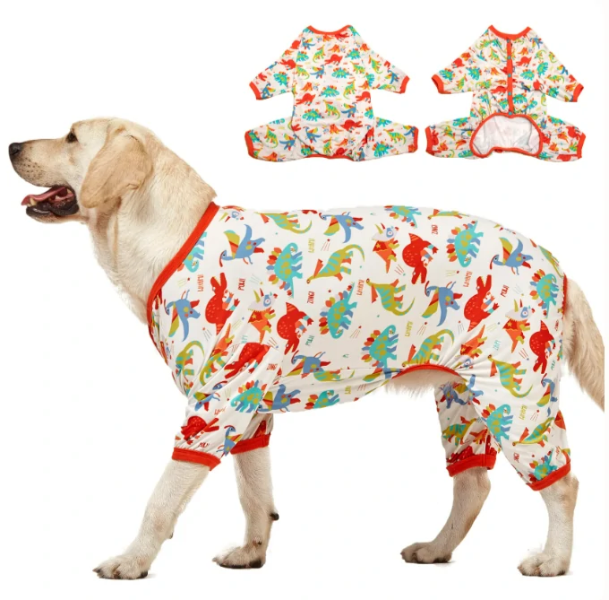 Yellow dog in vibrant dinosaur-themed pajamas with red cuffs, showcasing a playful print and two inset views of the pajama's full design.