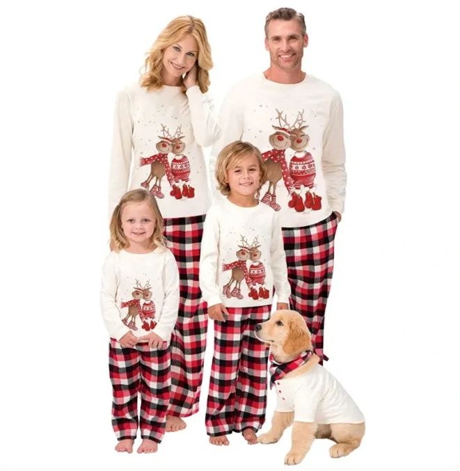Family of four dressed in matching Christmas reindeer pajamas with their golden retriever, wearing a matching outfit, creating a fun holiday-themed look.