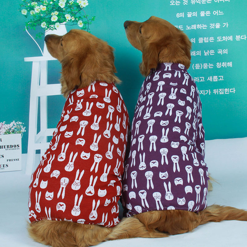 Two Golden Retrievers wearing Lovinpet cotton dog pajamas, one in red and the other in purple, both featuring a white rabbit pattern, showcasing comfort and style for large dogs.