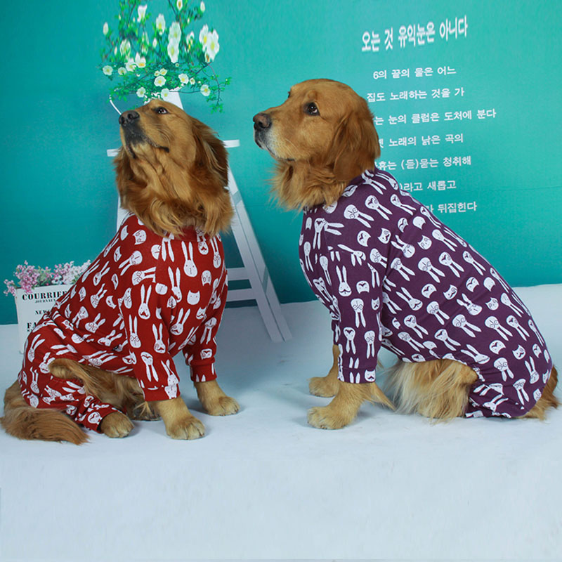 Two Golden Retrievers wearing Lovinpet dog pajamas, one in red and one in purple, both with a white rabbit pattern, highlighting the comfortable and stylish design for large dogs.