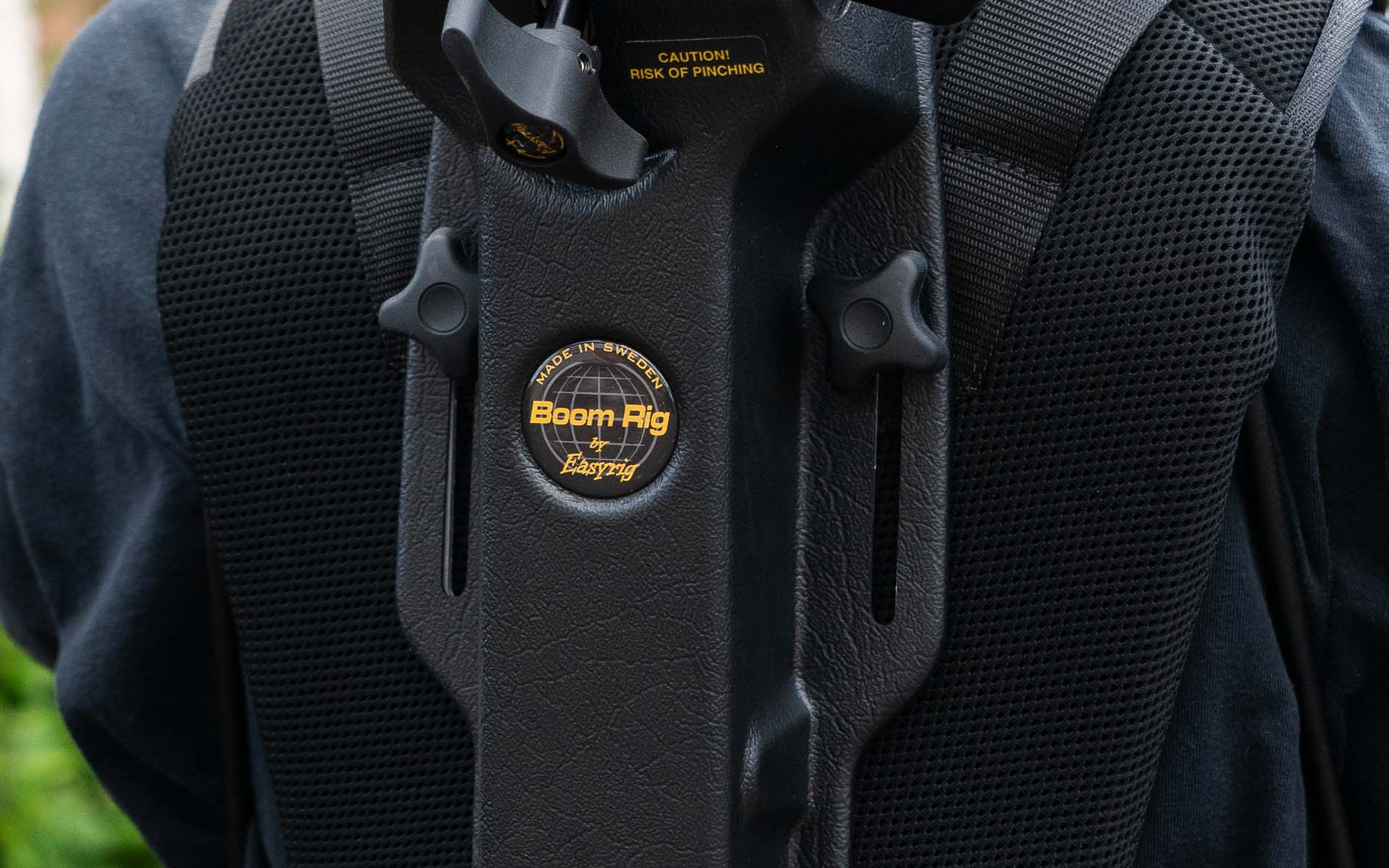 Plastic hardback case with Hydraulic arms to support boom operators