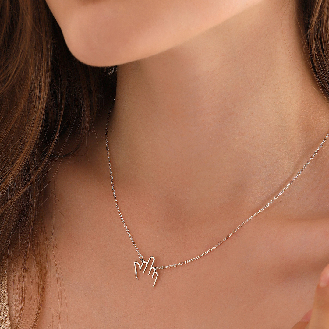 Hollow middle finger necklace