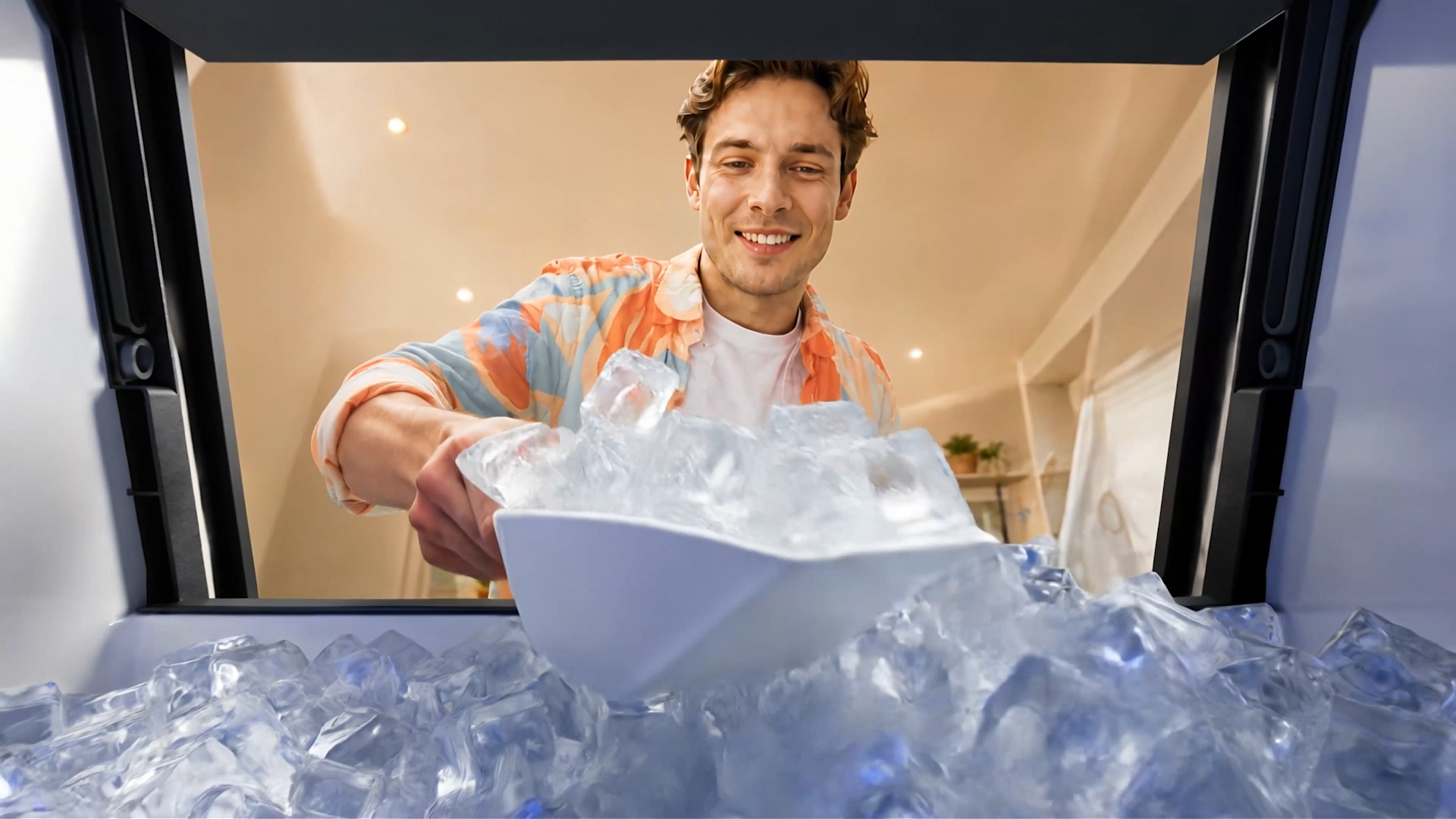 Mojgar ice maker filled with clear ice cubes for continuous ice supply
