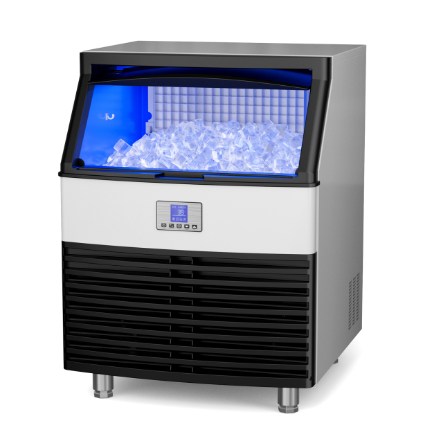 A modern commercial ice maker by Mojgar with a silver body, a transparent glass top showing a pile of ice cubes, blue interior lighting, a black ventilation panel at the bottom, and a digital display screen.