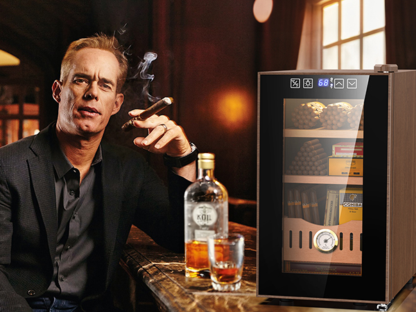 Mojgar 25L Thermoelectric Cigar Humidor in a luxurious bar setting, ideal for cigar enthusiasts. Features precise temperature control and ample storage for cigars, ensuring freshness and flavor preservation.