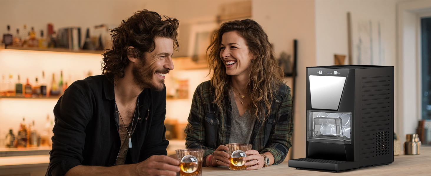 Friends enjoying whiskey with clear ice spheres made by Mojgar ice ball maker