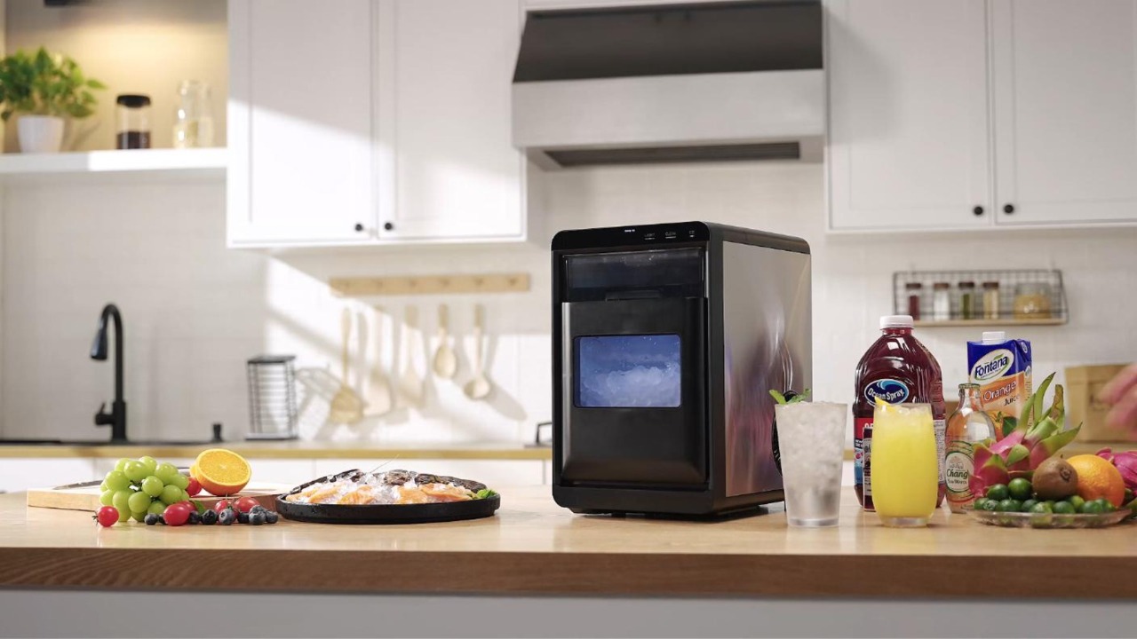 Mojgar countertop nugget ice maker on kitchen counter with fresh fruits and drinks