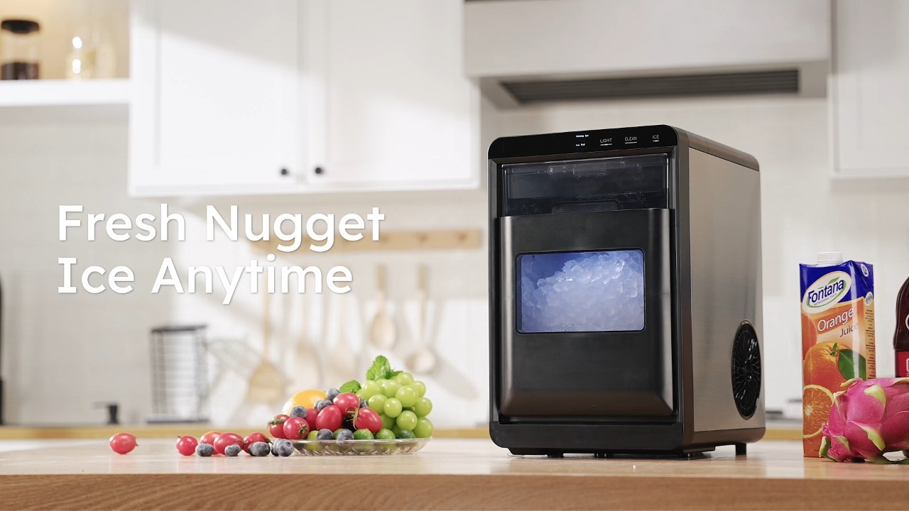 Mojgar nugget ice maker on home kitchen counter surrounded by beverages and fresh fruit