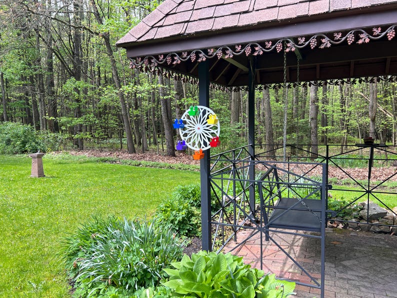Shown with the Standard Universal Mounting Bracket that comes with every Whirly Wheel Feeder. Mount on Trees, Fences, Decks, Railings, Square Posts.  The Whirly Wheel Feeder is 16 inch in diameter & approx. 7.5 inches out from whatever its mounted to