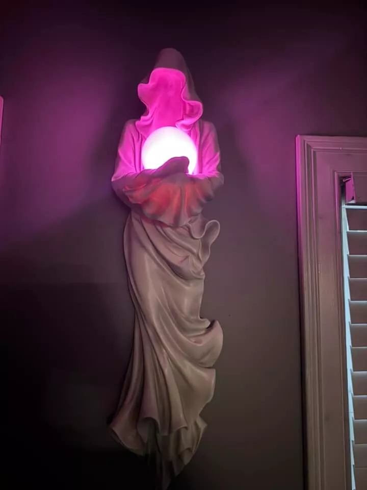 Wall mounted glowing ghost