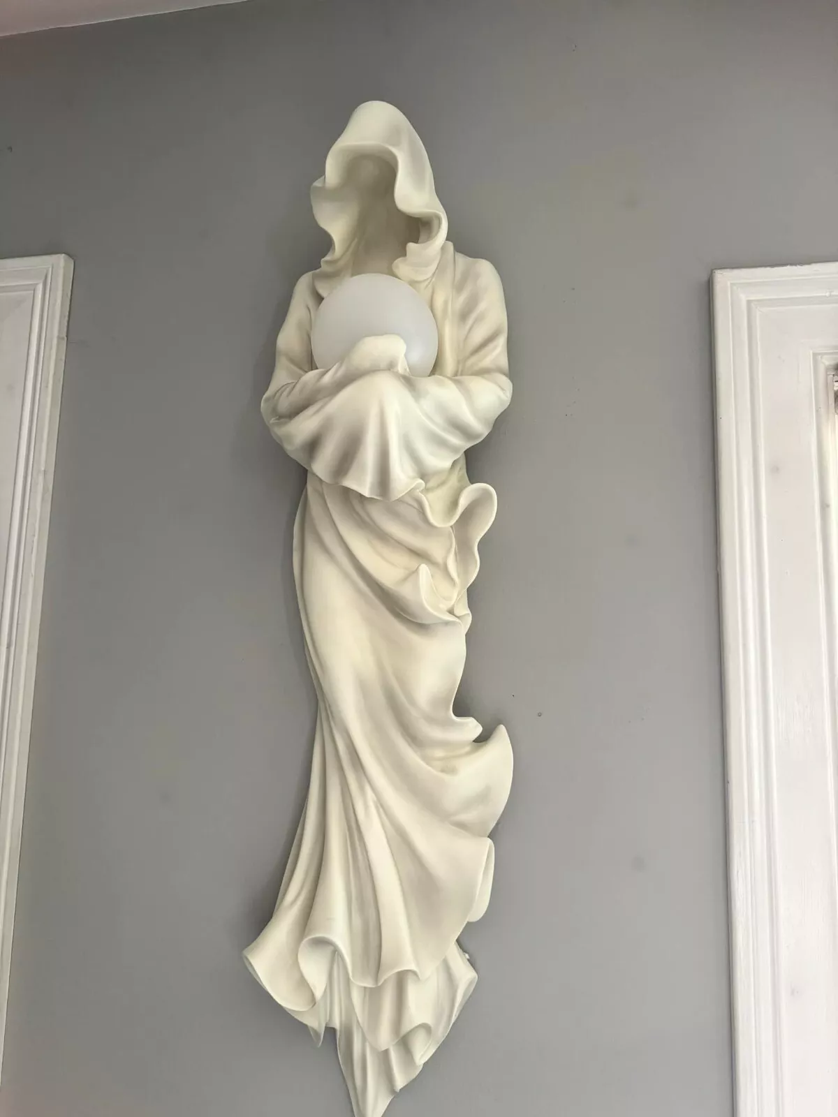 Wall mounted glowing ghost