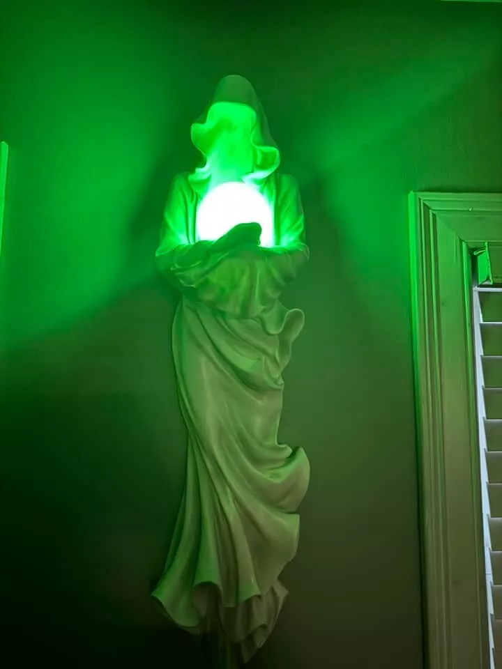 Wall mounted glowing ghost