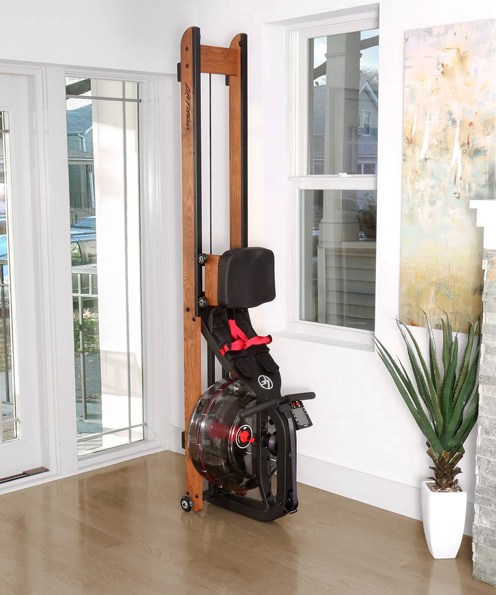 Life Fitness Row HX Trainer standing upright being stored in home
