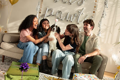 Group of Friends Celebrating a Pet's Birthday