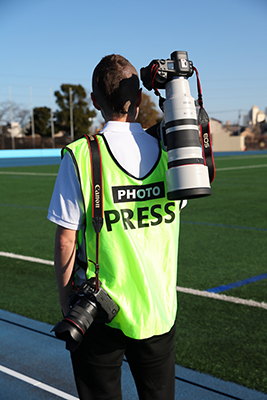 Person Carring Two Cameras