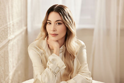 Person Sitting Posing in Front of a Window