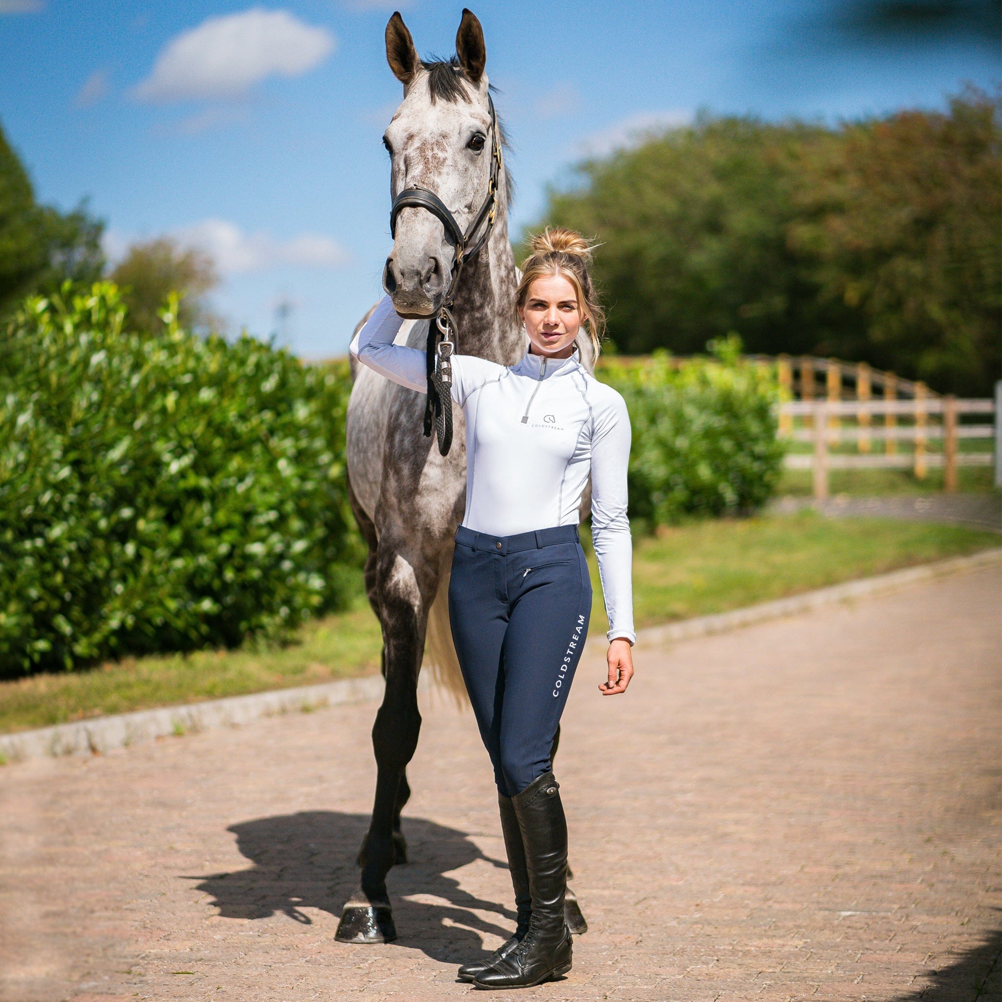 Coldstream Kilham Silicone Full Seat Competition Breeches 24982 Navy On Model Standing With Grey Horse