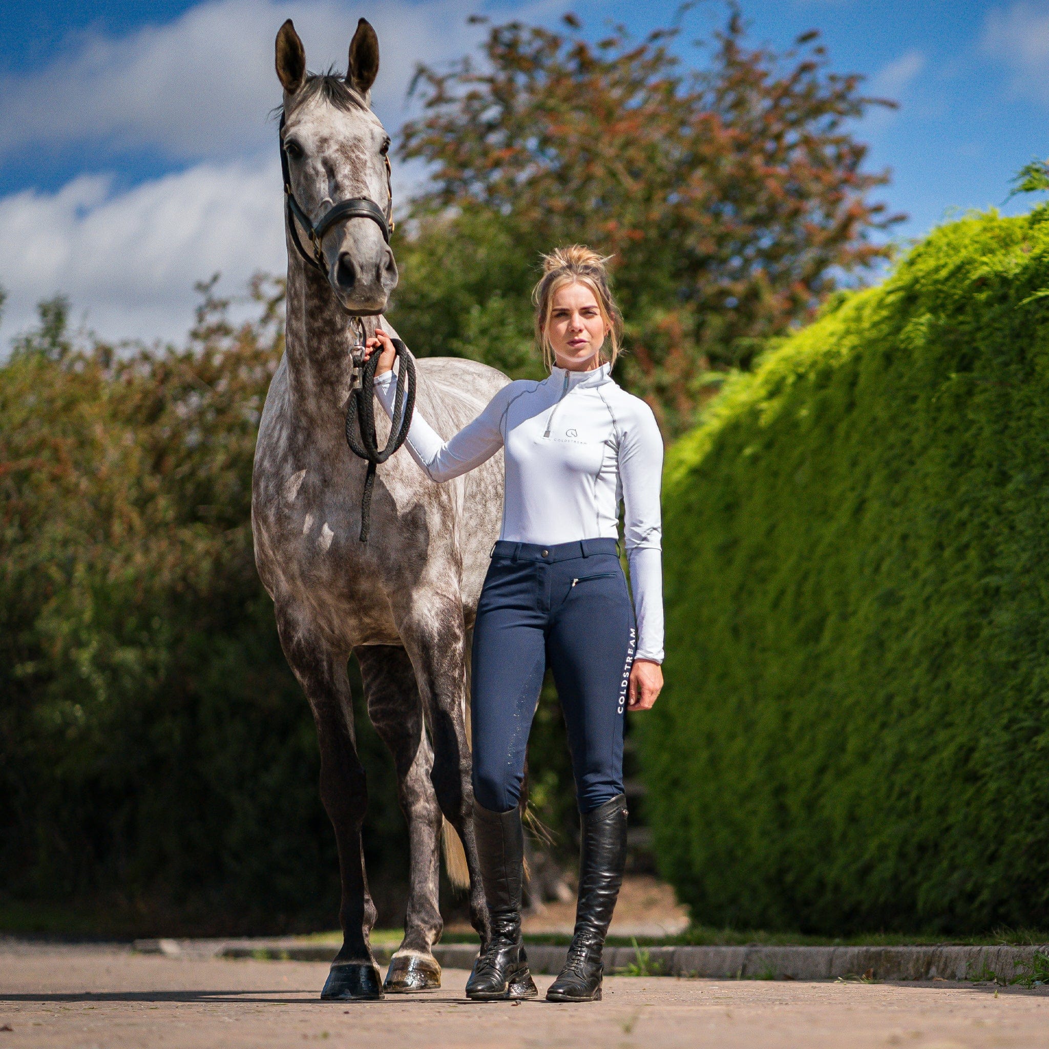 Coldstream Kilham Silicone Full Seat Competition Breeches 24982 Navy On Model Standing With Horse