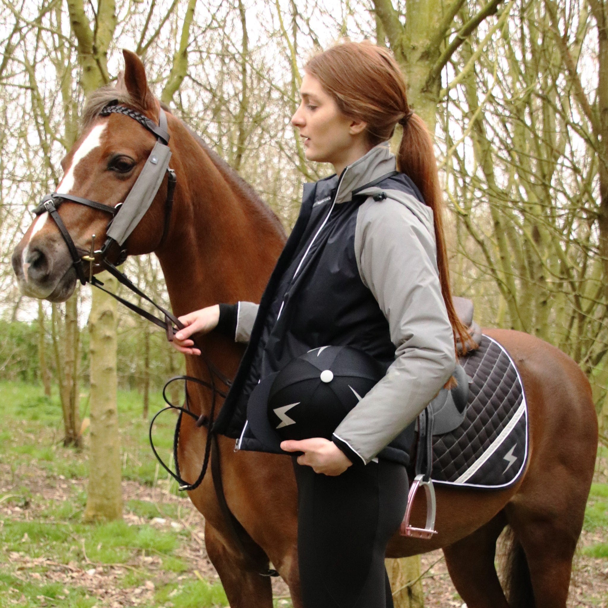 Hy Equestrian Silva Flash Reflective Hi Viz Waterproof Padded Jacket 33572 Black and Silver On Rider With Pony