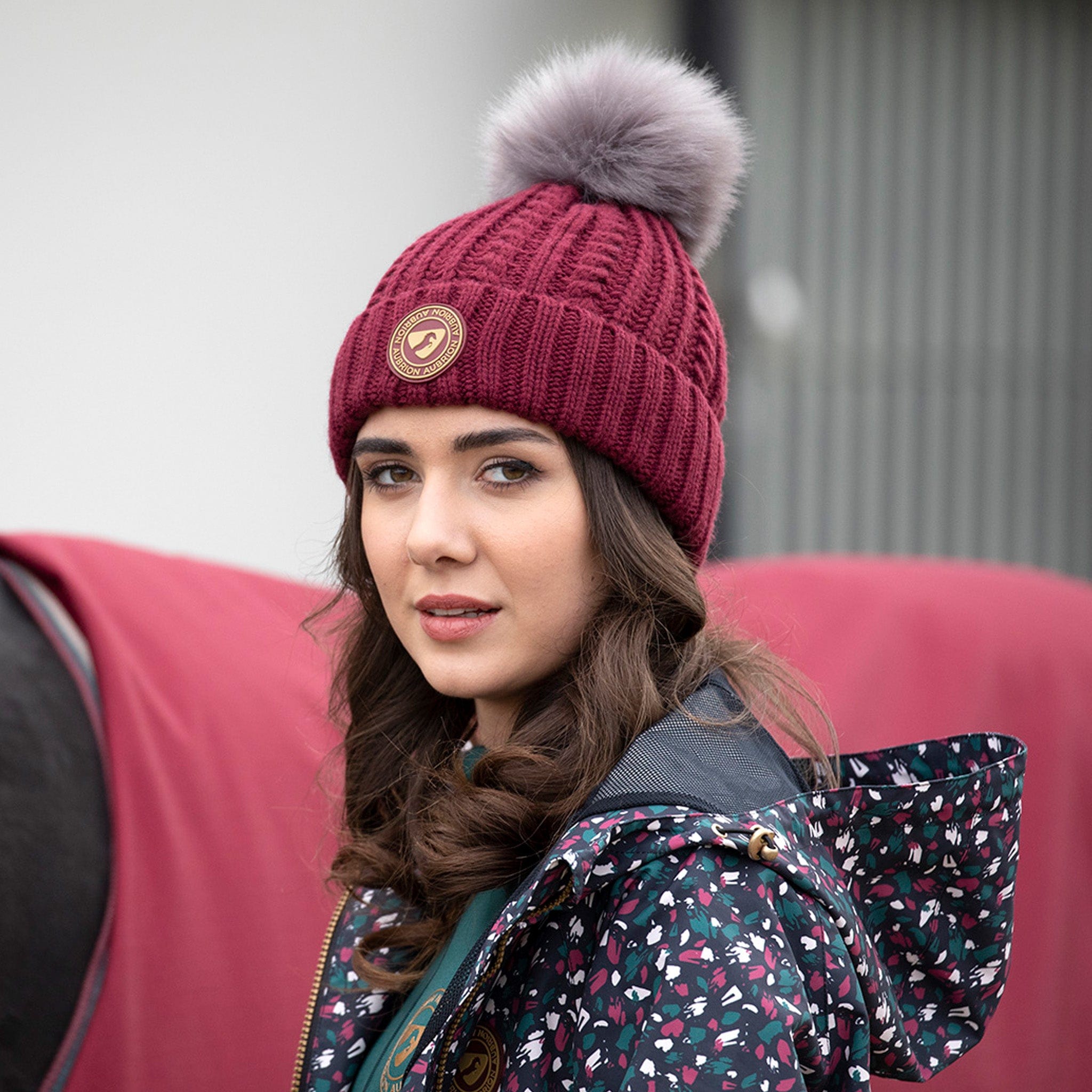 Aubrion Pimlico Bobble Hat 8168 Wine Red On Model With Brushstroke Jacket