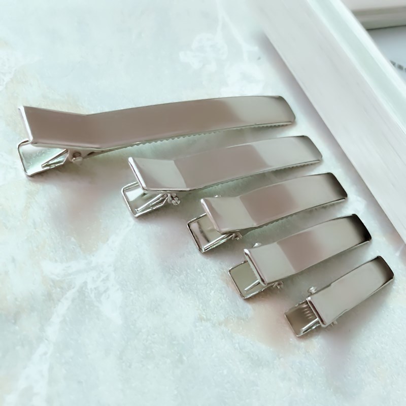 Pinzas de Pato Coreanas con Cola Levantada - Mayorista de Accesorios para Cabello con Doble Diente Reforzado 