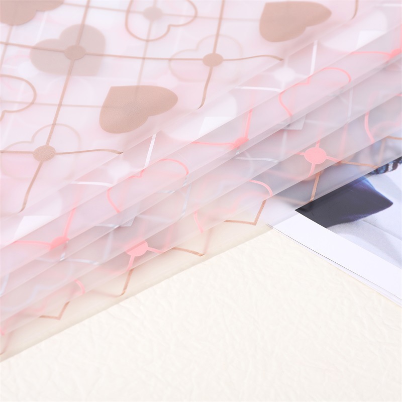 Film Mate para Envolver Flores con Diseño 'Corazones Radiantes' - Estilo Moderno y Fresco - Papel Impermeable para Florerías Jóvenes - Venta al por Mayor (Nuevo Diseño 2024)