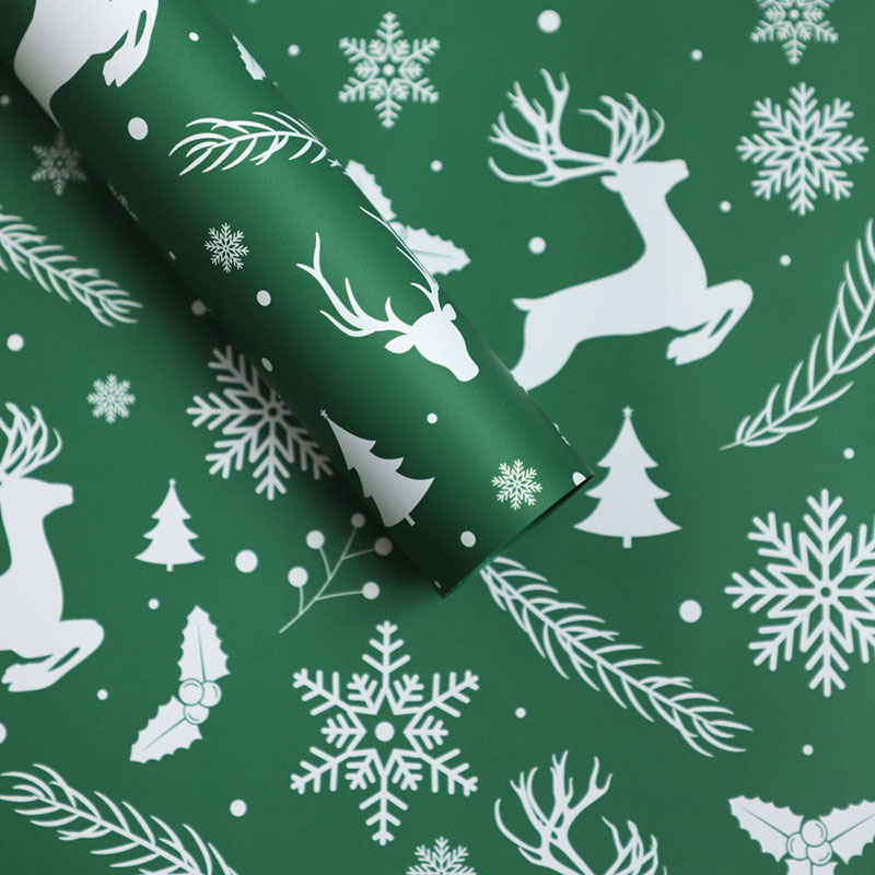 Papel de Regalo Navideño Premium con Diseños de Reno y Copos de Nieve