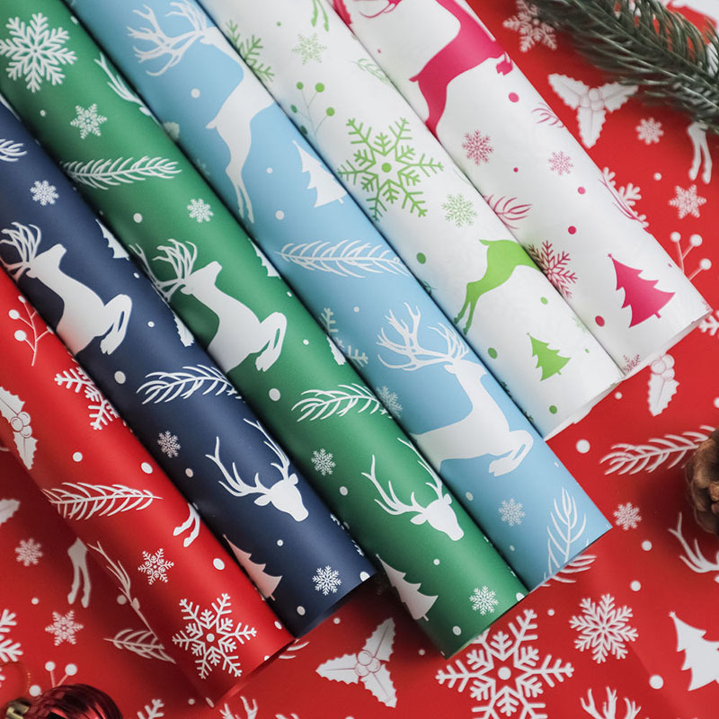 Papel de Regalo Navideño Premium con Diseños de Reno y Copos de Nieve