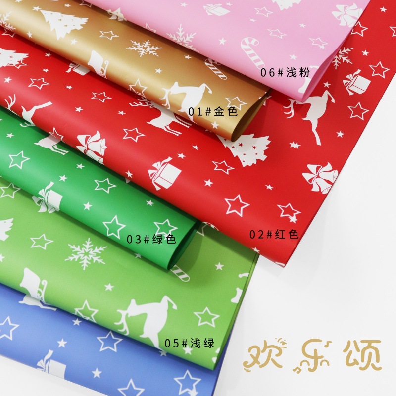 Papel de Regalo Navideño con Diseños de Renos y Campanas - Para Ramos Florales y Cajas de Regalo 