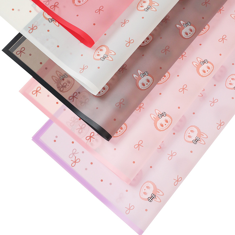 Papel Impermeable para Flores con Corazones/Moños - Diseño Labubu Cartoon (Borde Mágico) | Mayoreo Exportación-ywys