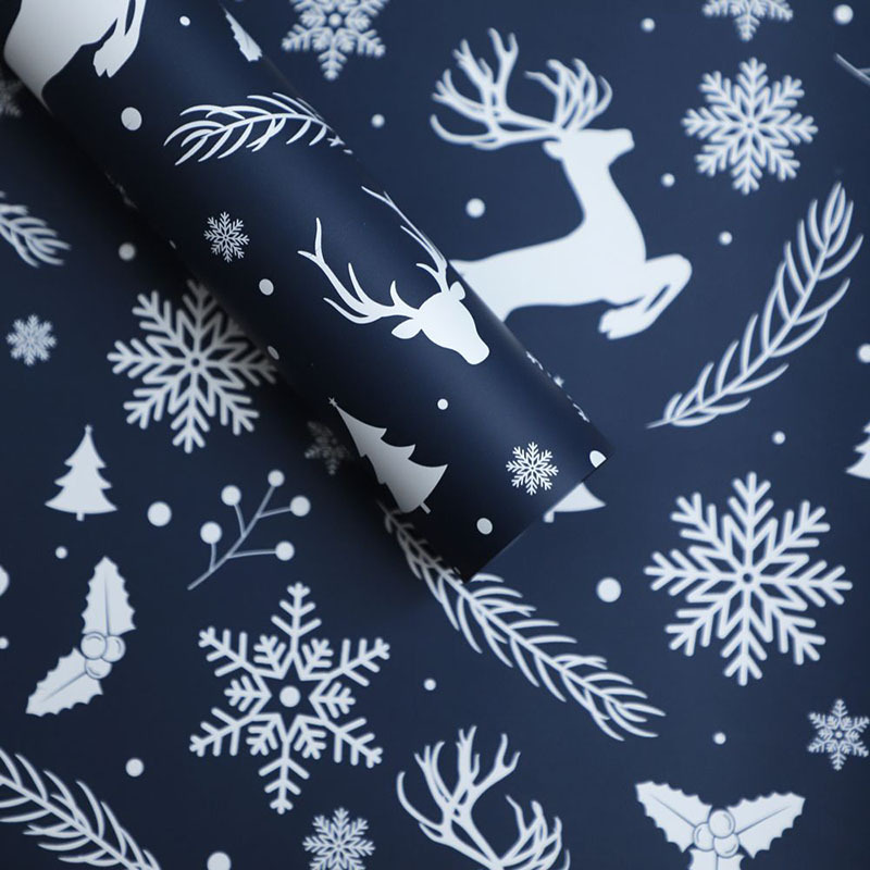 Papel de Regalo Navideño Premium con Diseños de Reno y Copos de Nieve