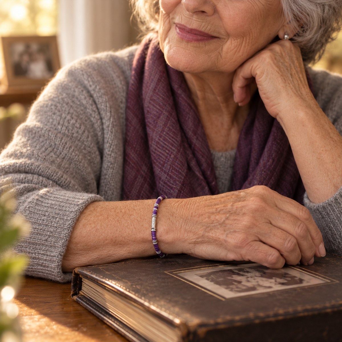 An elderly woman wearing the purple awareness bracelet