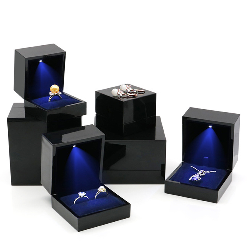 Square black glossy high-end jewelry box with light
