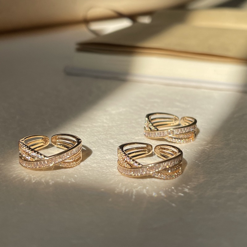 Cross-wrapped gold rings
