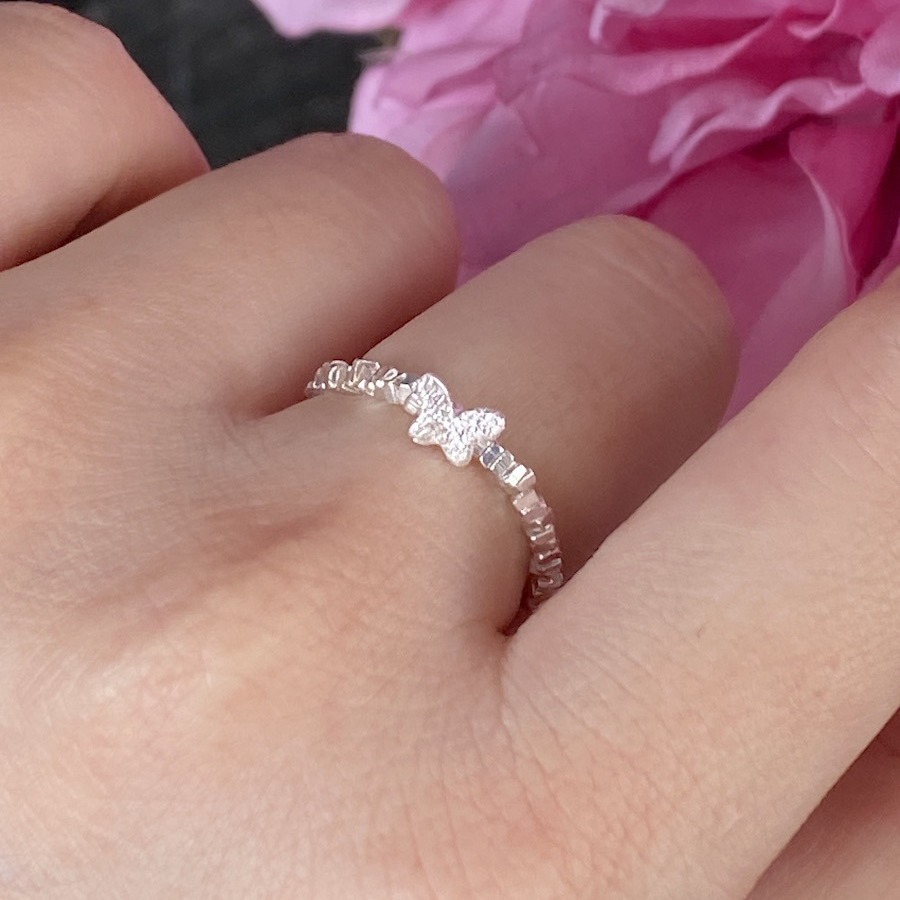 An all-over 925 silver crushed silver small butterfly ring