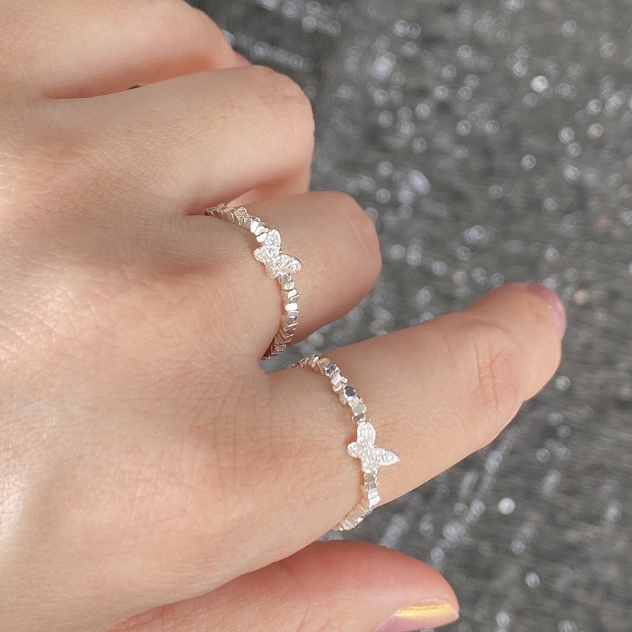 An all-over 925 silver crushed silver small butterfly ring
