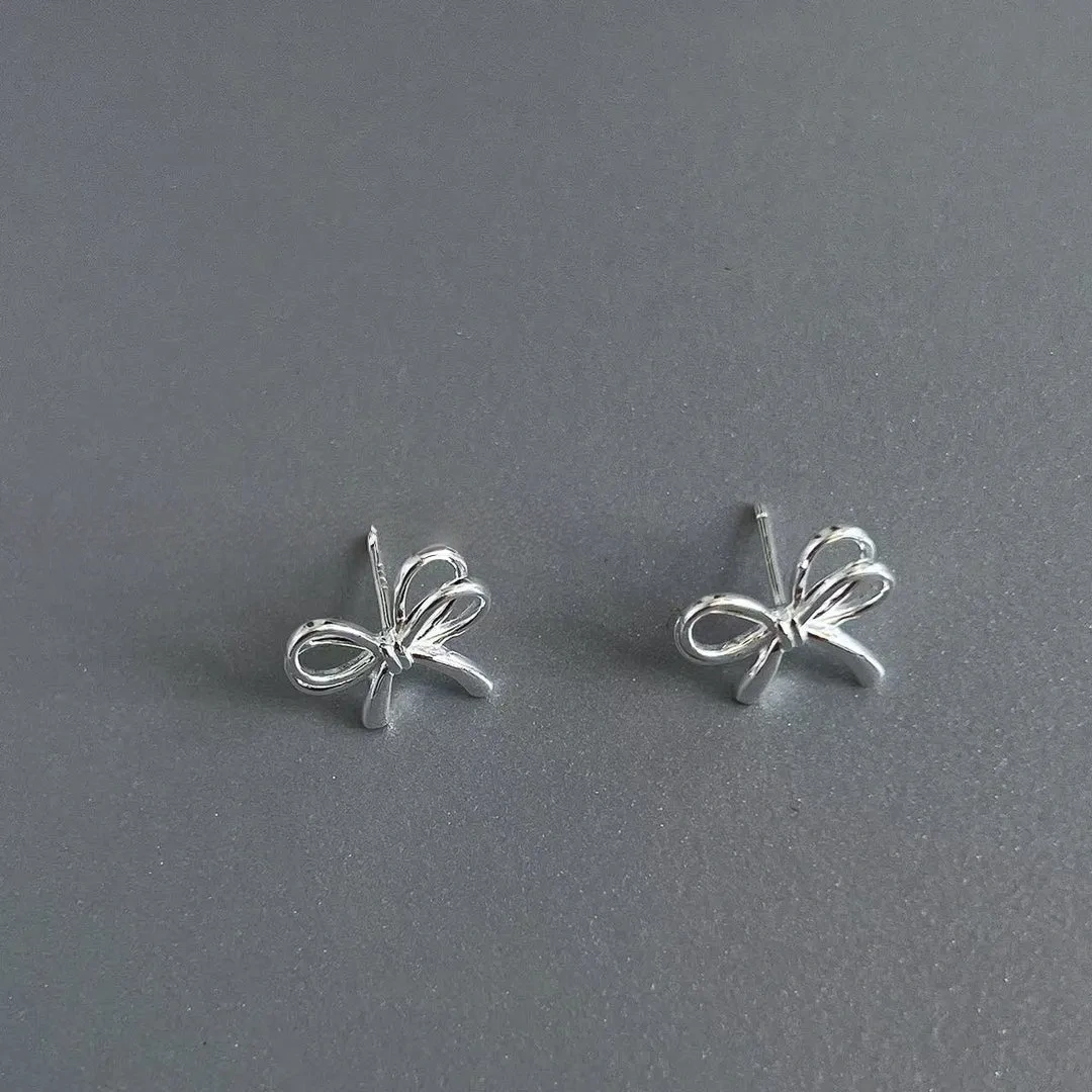 925 silver bow cut-out earrings
